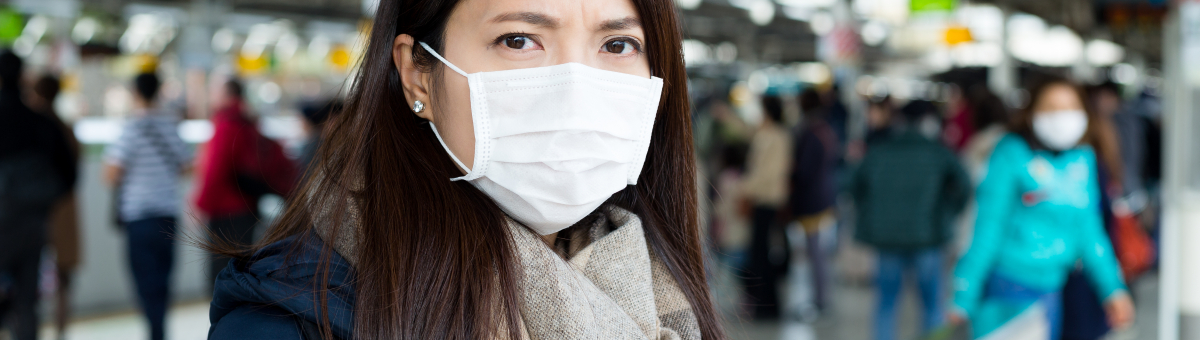 A woman wearing surgical mask in public place